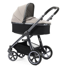 BabyStyle Oyster 3 Gunmetal LUXURY Bundle (Stone) - showing the carrycot and chassis together as the pram