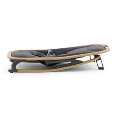 BabyStyle Oyster Rocker (Fossil) - sideview, showing the rocker with its feet down to stop rocking motion