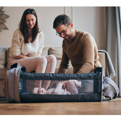 Bizzi Growin Baby Travel Crib Changing Bag - RUCPOD® (Windsor Grey) - lifestyle image, showing the crib being enjoyed by an infant