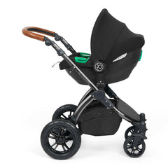Ickle Bubba Stomp LUXE Travel System with Cirrus Car Seat & ISOFIX Base (Black/Charcoal/Tan) - showing the included Ickle Bubba Cirrus i-Size Car Seat fixed to the pushchair`s chassis using the included adaptors