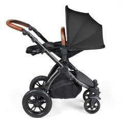 Ickle Bubba Stomp LUXE Travel System - Black/Midnight/Tan - showing the seat unit and chassis together as the pushchair in parent-facing mode with the seat reclined