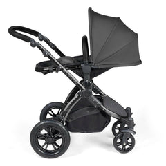 Ickle Bubba Stomp LUXE Travel System with Cirrus Car Seat & ISOFIX Base - Black/Charcoal/Black - showing the pushchair in parent-facing mode with seat reclined