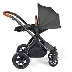 Ickle Bubba Stomp LUXE Travel System with Cirrus Car Seat & ISOFIX Base (Black/Charcoal/Tan) - showing the seat unit and chassis together as the pushchair in parent-facing mode with the seat reclined