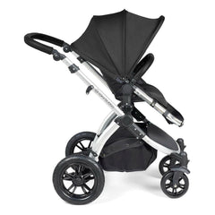Ickle Bubba Stomp LUXE Travel System - Silver/Midnight/Black - side view, showing the forward-facing pushchair with the seat upright