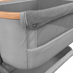 Maxi-Cosi Iora Co-Sleeping Crib (Essential Grey) - close view, showing the mesh front panel