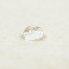 SnuzPod2 Waterproof Crib Mattress Protector - showing water sitting on top of the protector