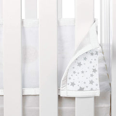 Breathable Baby Cot Bed Set (Twinkle Grey) - showing one of the panels being attached to the cot bed sides (cot bed not included)