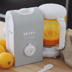 BEABA Babycook® Solo Express - Weaning Bundle (Grey/Blue) - showing the Express machine after cooking and blending carrots