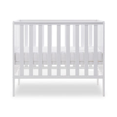 Obaby Bantam Space Saver Cot (White) - side view, shown with mattress base at its middle level