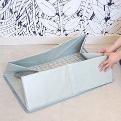 BEABA Camele'O Pop-Up Bath (Green Blue) - showing the bath being folded for transport or storage