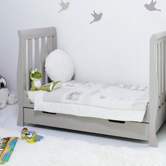 Obaby Stamford Mini Sleigh Cot Bed with SPRUNG Mattress (Warm Grey) - lifestyle image of the junior bed (bedding and toys not included)