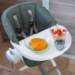 BEABA Seat Cushion for Up and Down Highchair - Infant/Toddler (Sage Green) - showing the cushion fitted to the highchair with its safety harness pulled through its fitting slots (cup, bowl and plate not included)