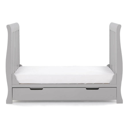 Obaby Stamford MINI Sleigh Cot Bed with Drawer (Warm Grey) - side view, shown here as the junior bed (mattress not included)