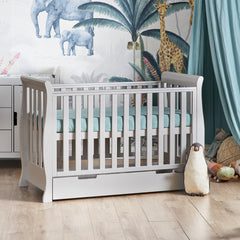 Obaby Stamford MINI Sleigh Cot Bed with Drawer (Warm Grey) - lifestyle image (mattress, bedding, changing unit and toys not included)
