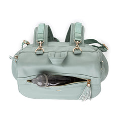Bizzi Growin Lilli Changing Backpack (Vegan Leather - Mint) - showing the front flap`s zipped pocket (bottle not included)