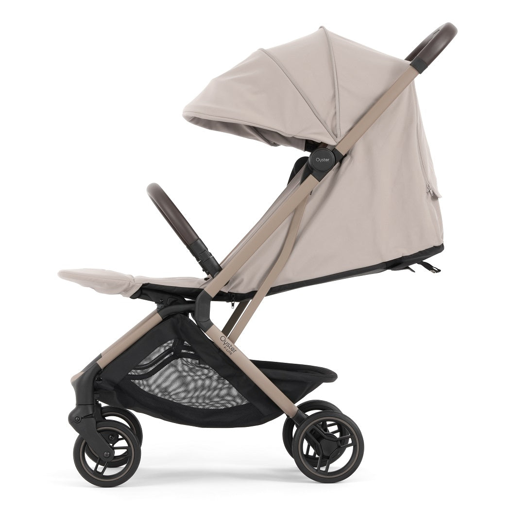 Oyster F-Lite Stroller - Putty - side view with seat reclined and calf rest raised