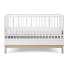 Obaby Astrid Cot Bed - 140x70cm White - side view with the mattress base at its middle level