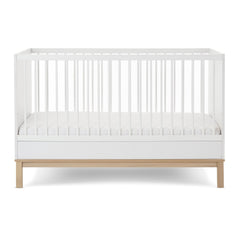 Obaby Astrid Cot Bed - 140x70cm White - side view with the mattress base at its lowest level
