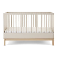 Obaby Astrid Cot Bed - 140x70cm Satin - side view with the mattress base at its lowest level