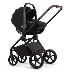 Venicci Tiago 360 i-Size car seat in Black attached to Claro 2 pushchair frame