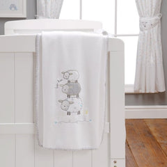 Silvercloud Counting Sheep 3 Piece Bedding Bale (Night Night Sleep Tight) - showing the fleece blanket hanging over a cot (cot not included, available separately)