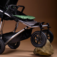 Mountain Buggy Duet V4 - tilted up with front wheels on a rock