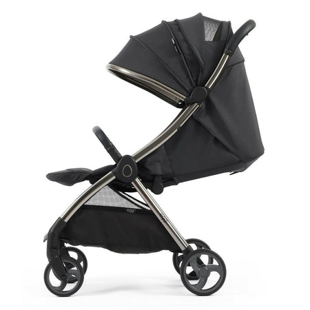 eggZ Stroller - Carbonite - side view with seat fully reclined, leg rest raised and hood extended
