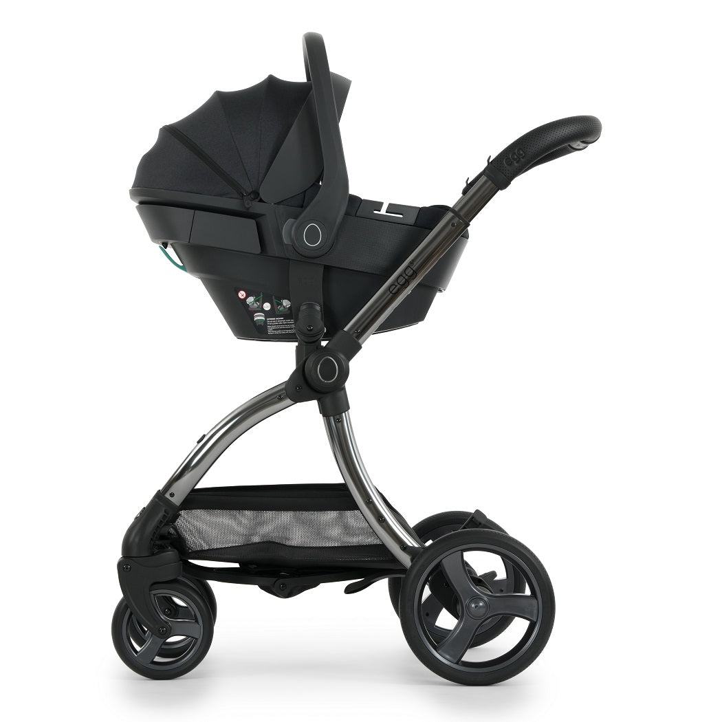 egg3 Gunmetal Chassis fitted with Shell 360 Infant Car Seat - Carbonite