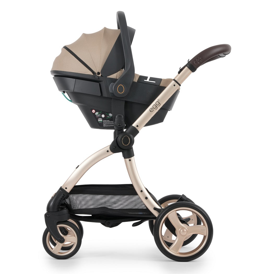 egg3 Gold Chassis fitted with Shell 360 Infant Car Seat - Feather