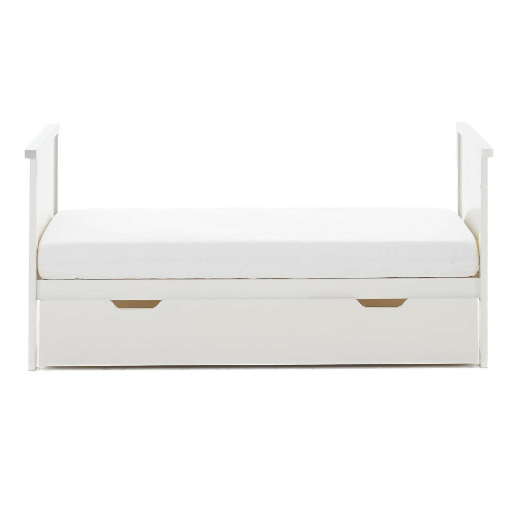 Obaby Evie MINI Cot Bed with Under Drawer - 120x60cm White - showing the junior bed with the under drawer