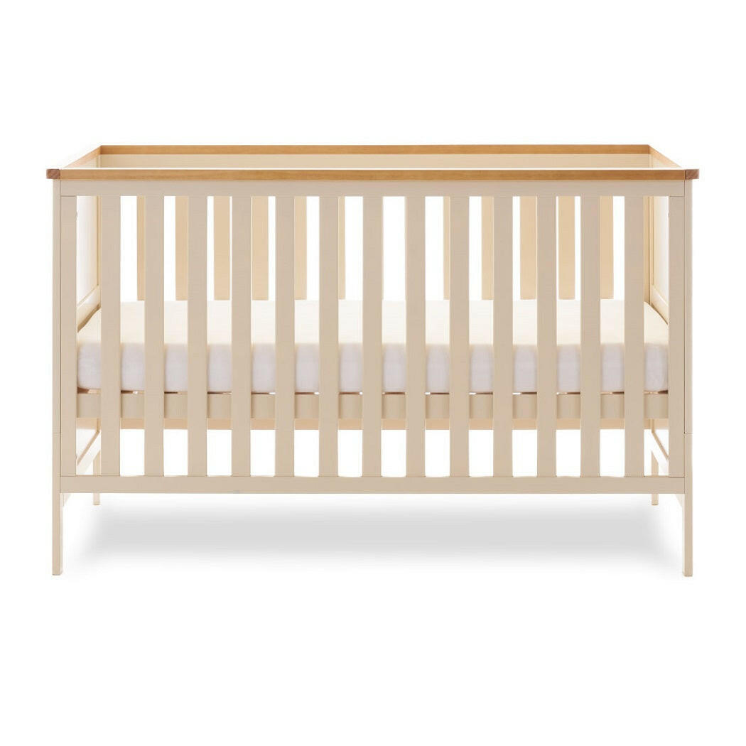 Obaby Evie Cot Bed - Cashmere - showing the cot with its mattress base at the middle level