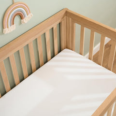 Clair De Lune Fitted Cot Bed Sheets (Pack of 2) - White - showing a sheet fitted to a cot bed mattress