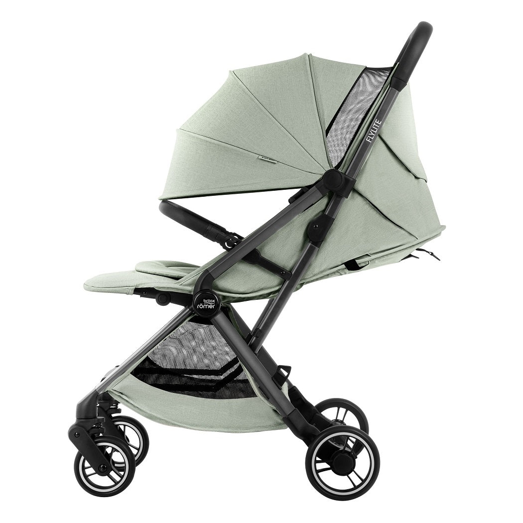 Britax Flylite Travel Stroller - Sage Green - side view with seat reclined, hood fully extended and leg rest raised