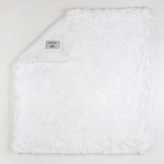 Bizzi Growin Koochicoo Soft & Fluffy Baby Blanket (Ice White) - showing the blanket`s fluffy exterior and its velour reverse fabric with its pompom detailing