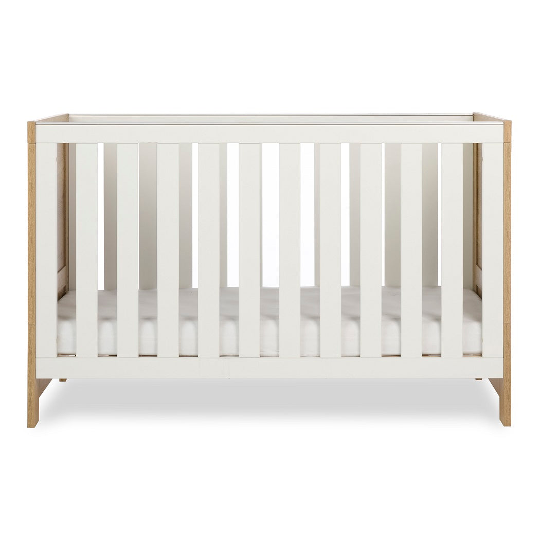 Obaby Nika Cot Bed Oak & White - side view, mattress base at lowest level