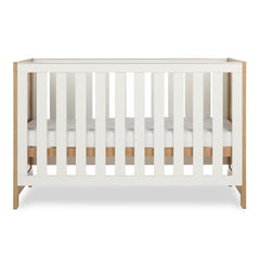 Obaby Nika Cot Bed Oak & White - side view, mattress base at middle level
