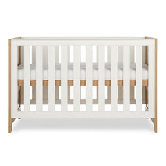 Obaby Nika Cot Bed Oak & White - side view, mattress base at highest level