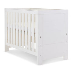 Obaby Nika MINI Cot - White Wash - shown with mattress base at highest level
