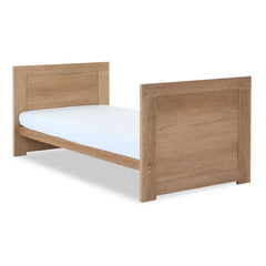 Obaby Nika Cot Bed - Oak - quarter view, converted into toddler bed
