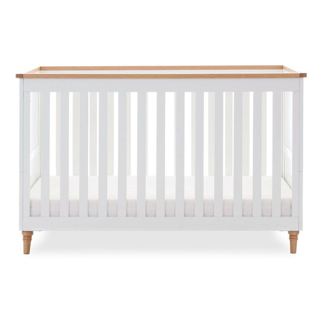 Obaby Orla Cot Bed - White with Oak - shown with mattress base at lowest level