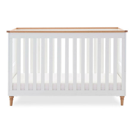 Obaby Orla Cot Bed - White with Oak - shown with mattress base at lowest level