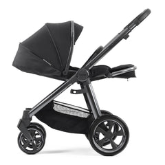 BabyStyle Oyster 3 Gunmetal ESSENTIAL Bundle (Carbonite) - side view, showing the parent-facing pushchair with the seat fully reclined and leg rest raised