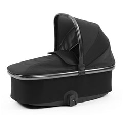 BabyStyle Oyster 3 Gunmetal LUXURY Bundle (Carbonite) - showing the carrycot with its hood and apron