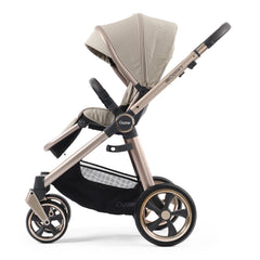 BabyStyle Oyster 3 Champagne ESSENTIAL Bundle (Creme Brulee) - side view, showing the forward-facing pushchair with its seat upright