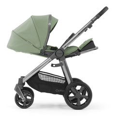 BabyStyle Oyster 3 Gunmetal LUXURY Bundle (Spearmint) - side view, showing the pushchair with its seat fully reclined and leg rest raised