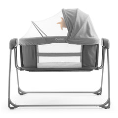 BabyStyle Oyster Swinging Crib (Moon) - side view, showing the crib`s mesh ventilation/viewing panels