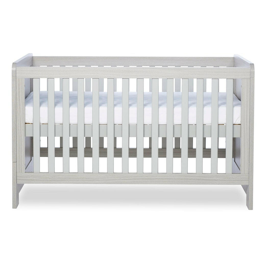 Ickle Bubba Pembrey Cot Bed - Ash Grey - side view, with mattress base at highest level
