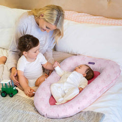 Clevamama ClevaSleep POD (Pink Stars) - lifestyle image, showing the pod being used on a parents` bed