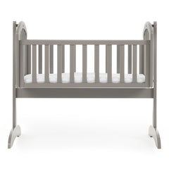 Obaby Sophie Swinging Crib (Taupe Grey) - side view, shown with the foam mattress