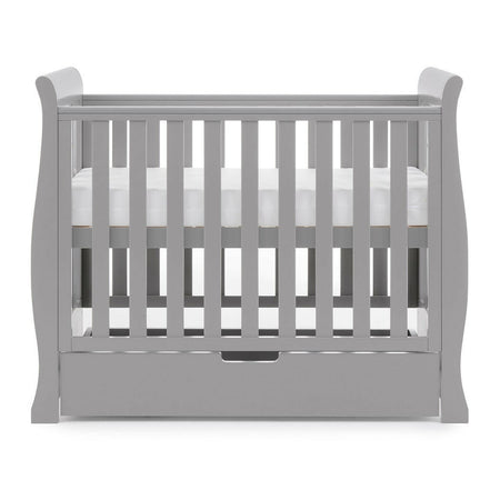 Obaby Stamford Space Saver Cot (Warm Grey) - side view, shown here with the mattress base at its highest level (mattress not included, available separately)